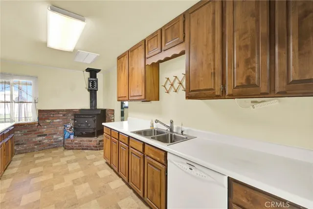 a white toilet sitting next to a bathroom sink
