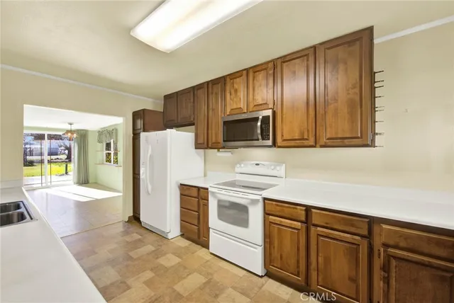 a view of a balcony with wooden floor and furniture