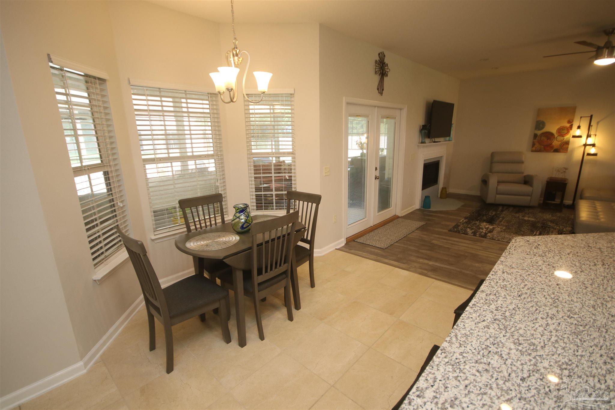 5895 Quintette Road Pace, FL 32571 - Photo 24 of 67 to the FL room. Kitchen w/ tile flooring.