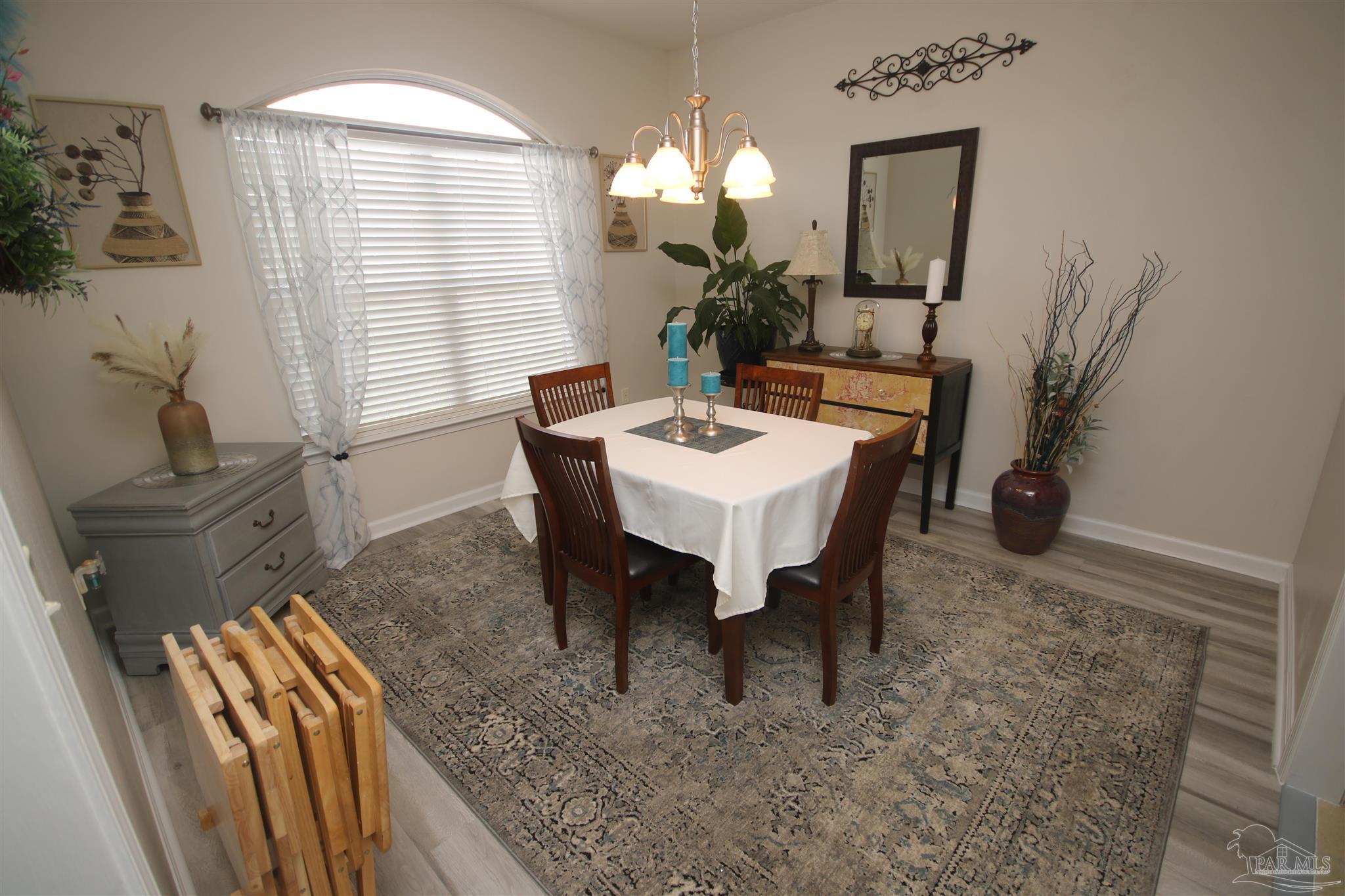 5895 Quintette Road Pace, FL 32571 - Photo 26 of 67 enjoys a nice flow to the family room & kitchen.