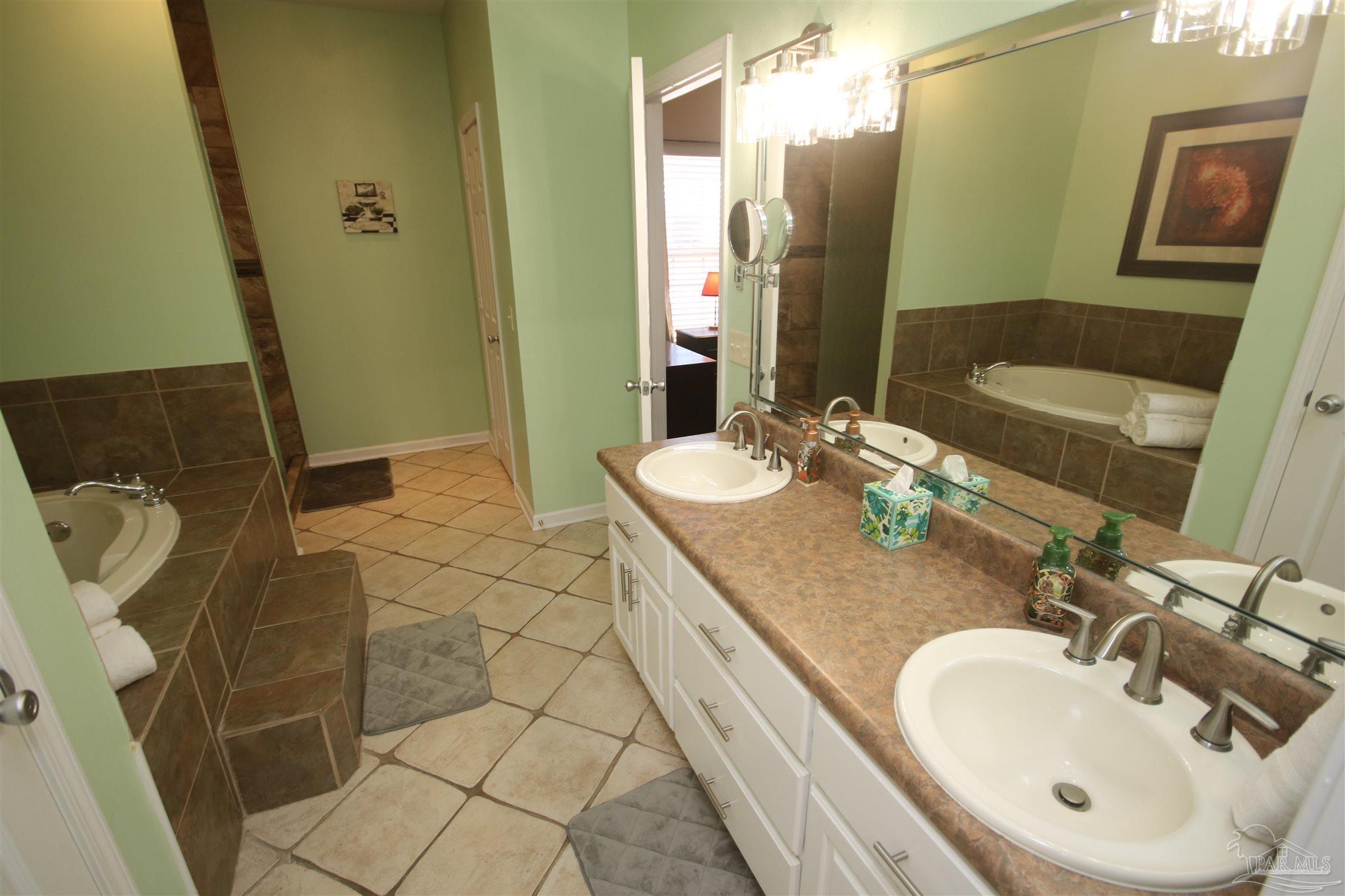 5895 Quintette Road Pace, FL 32571 - Photo 34 of 67 a long vanity & many drawers & cabinets.