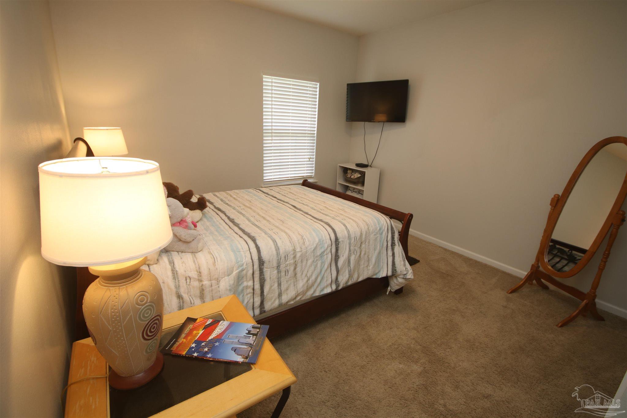 5895 Quintette Road Pace, FL 32571 - Photo 37 of 67 back of the home. Full bath & 2nd bdrm. down hall.