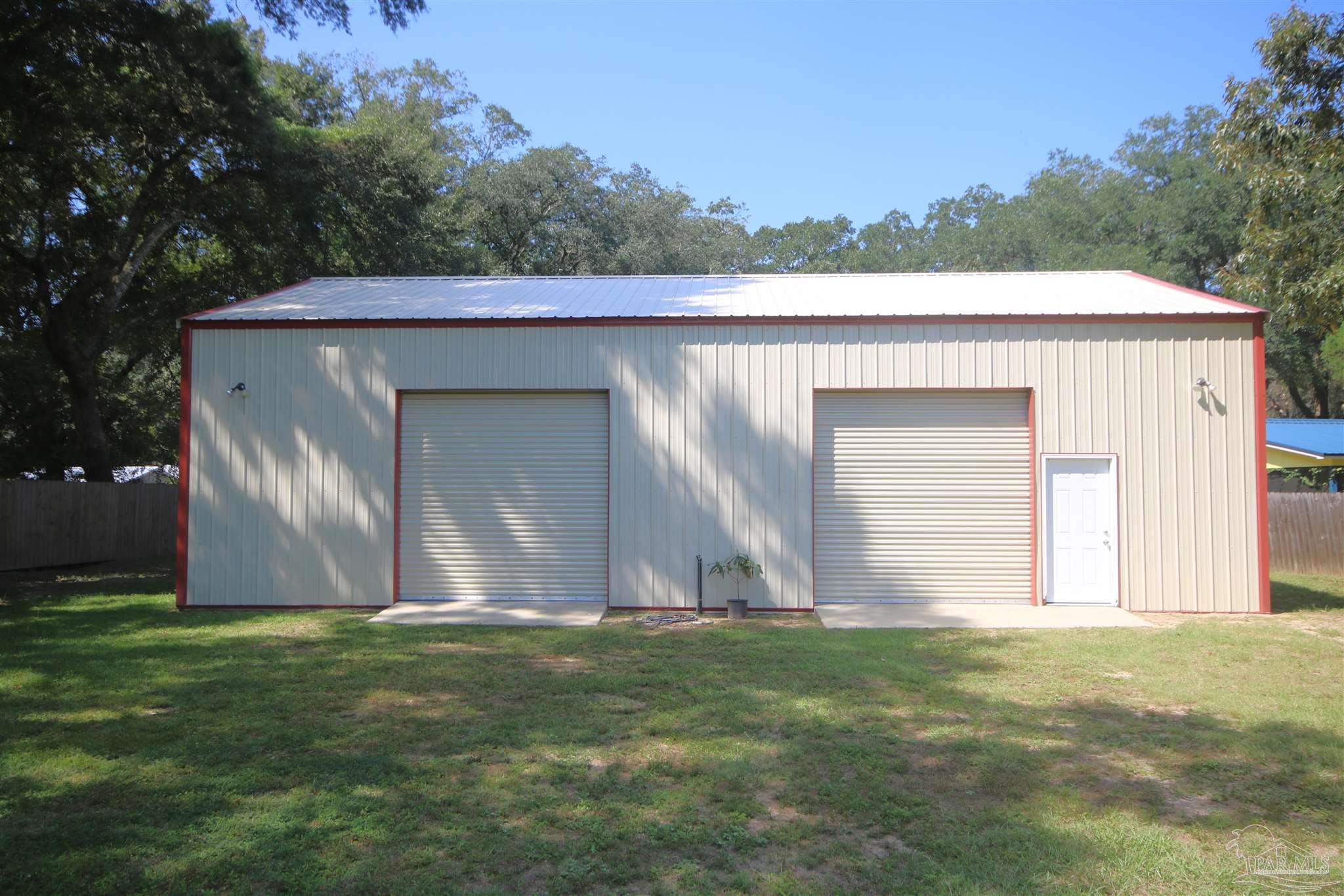 5895 Quintette Road Pace, FL 32571 - Photo 5 of 67 Enclosed Pole Barn. Power & water. Cement slab.