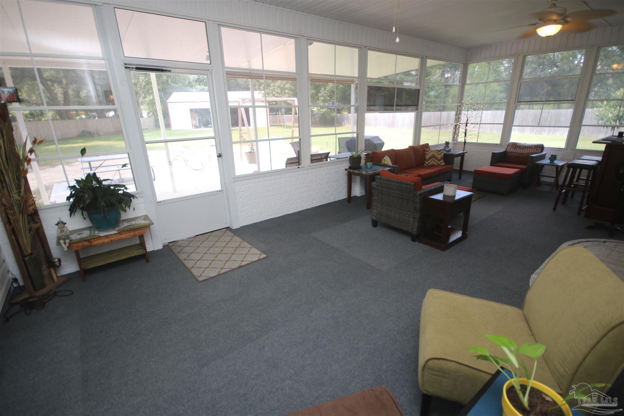 5895 Quintette Road Pace, FL 32571 - Photo 58 of 67 enclosed back porch w/ Lexan Horiz. Slide windows