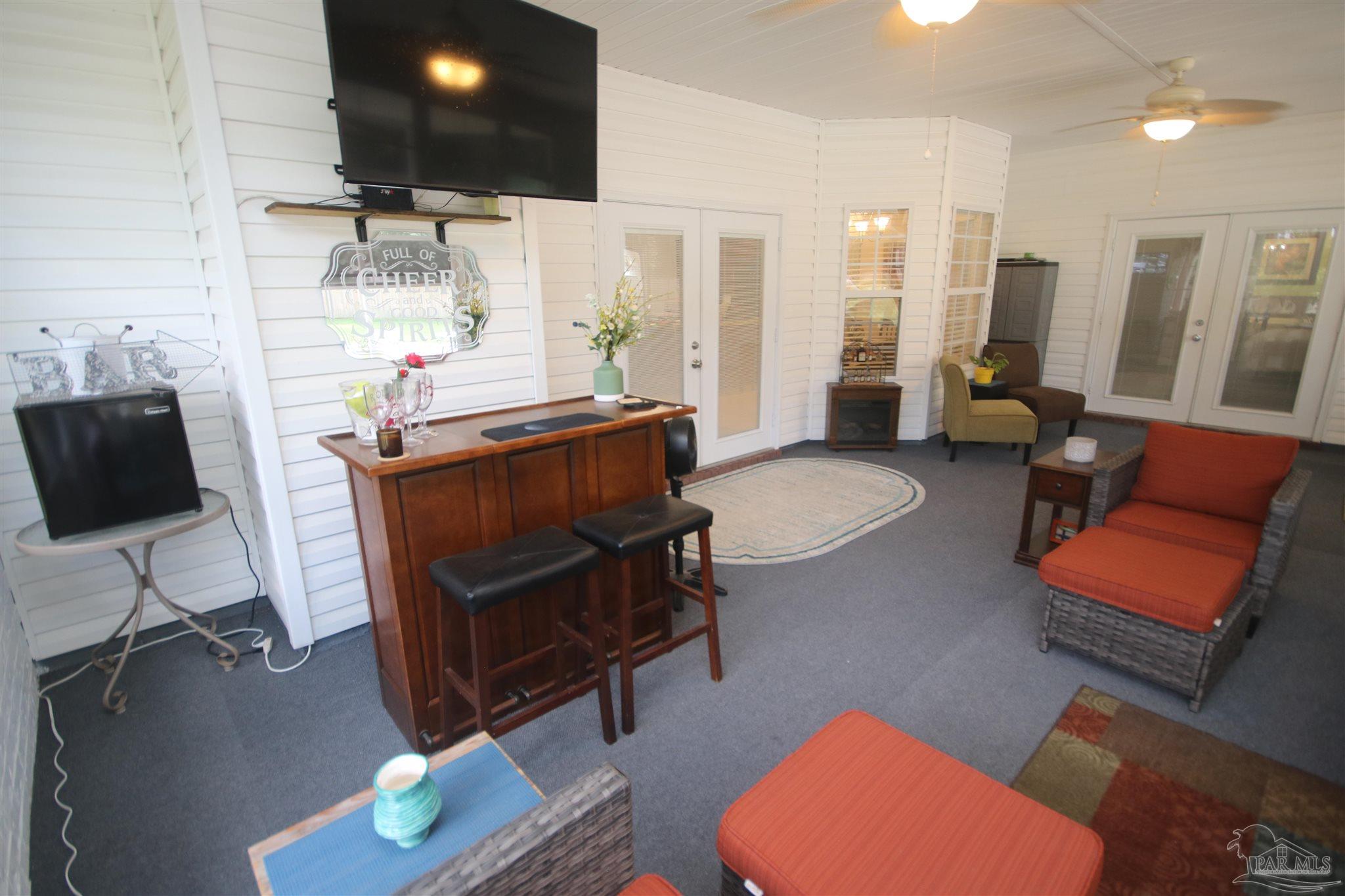 5895 Quintette Road Pace, FL 32571 - Photo 59 of 67 fans & wall to wall indoor/outdoor carpet tiles.
