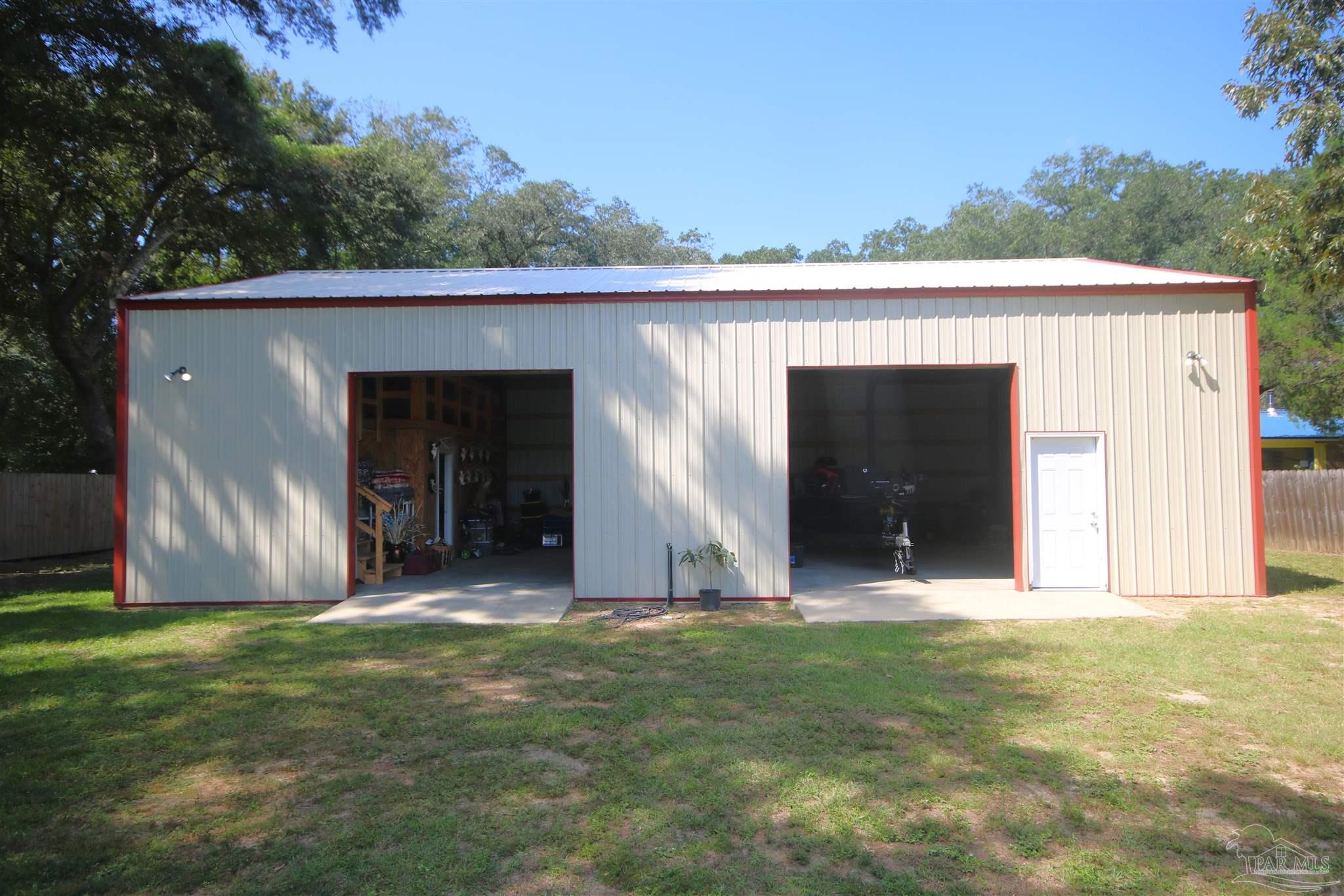 5895 Quintette Road Pace, FL 32571 - Photo 7 of 67 9"10" H & 10' W. Ceilings inside peak @ 18'.
