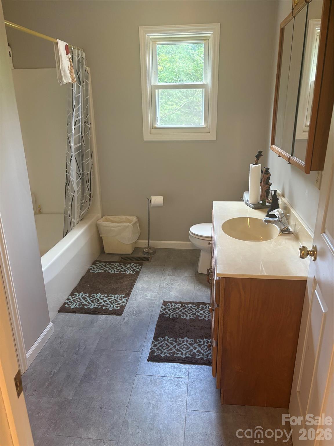 3880 Love Road Claremont, NC 28610 - Photo 14 of 14 a bathroom with a sink toilet and shower