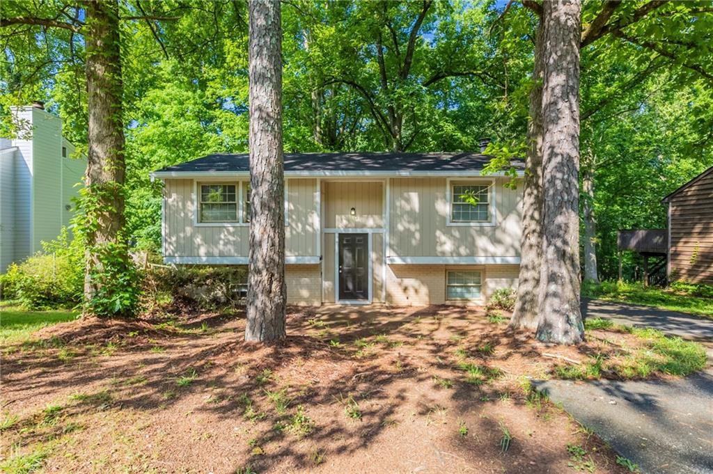 5372 Martins Crossing Road Stone Mountain, GA 30088 - Photo 1 of 1 front view of a house with a large tree