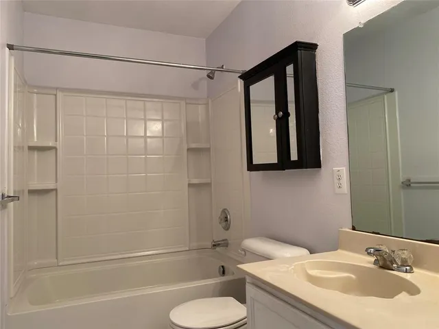 a view of a park with big trees