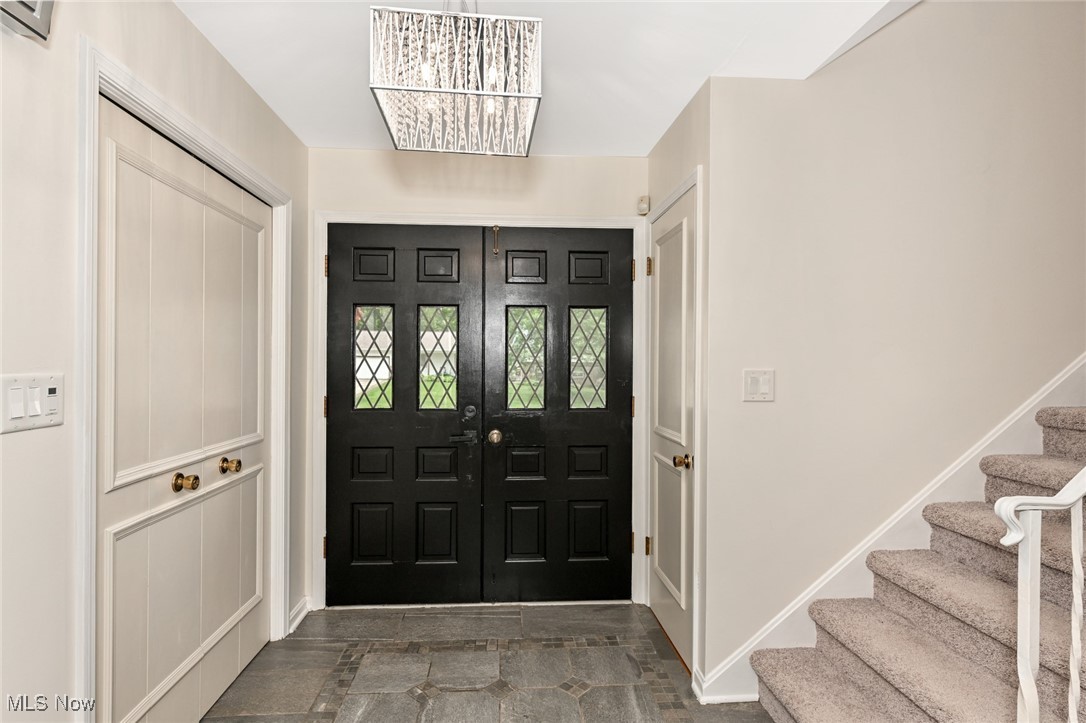 2015 Burlington Road Akron, OH 44313 - Photo 5 of 50 Foyer with stairs, french doors, and a chandelier