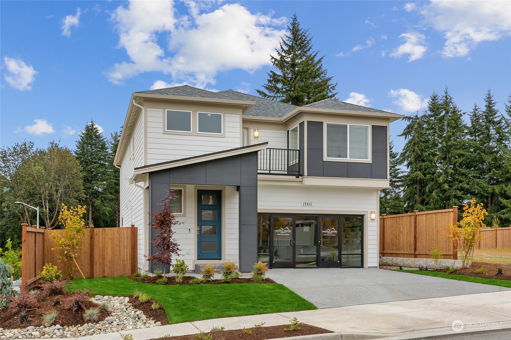 2025 228th Place Southwest, Unit EP 05 Bothell, WA 98021 - Photo 3 of 3 a front view of a house with a yard and garage