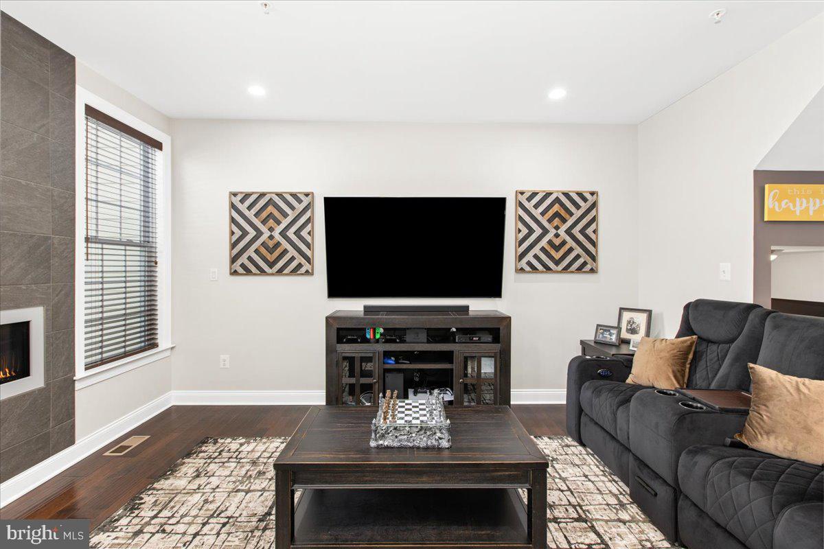 2617 Maple Rock Road Hanover, MD 21076 - Photo 20 of 53 a living room with furniture and a flat screen tv