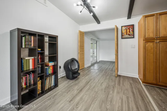 a view of room with furniture and wooden floor