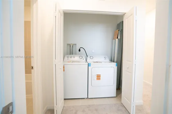 a utility room with dryer and washer