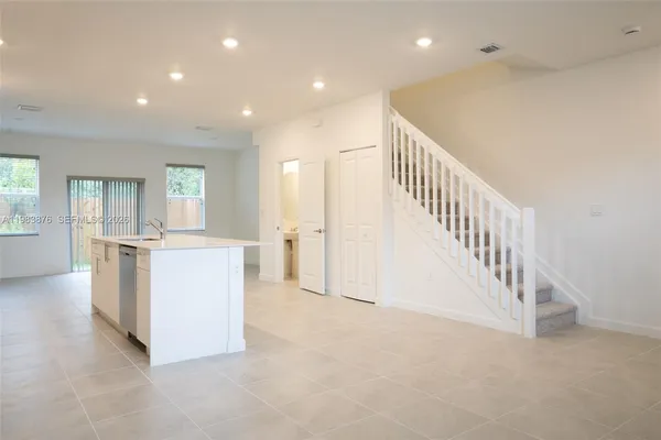 a view of kitchen and hall with furniture