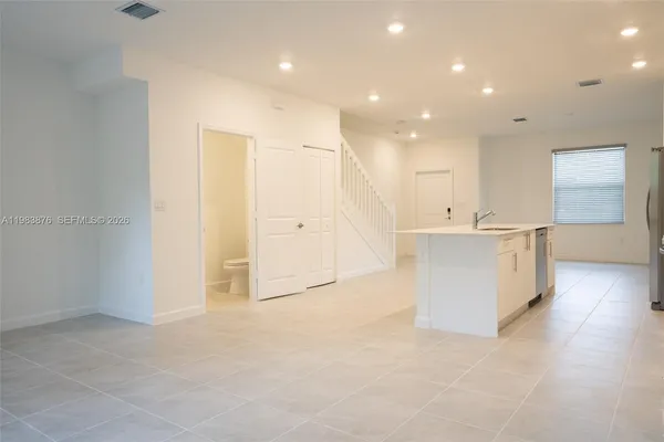 a view of an empty room with a window