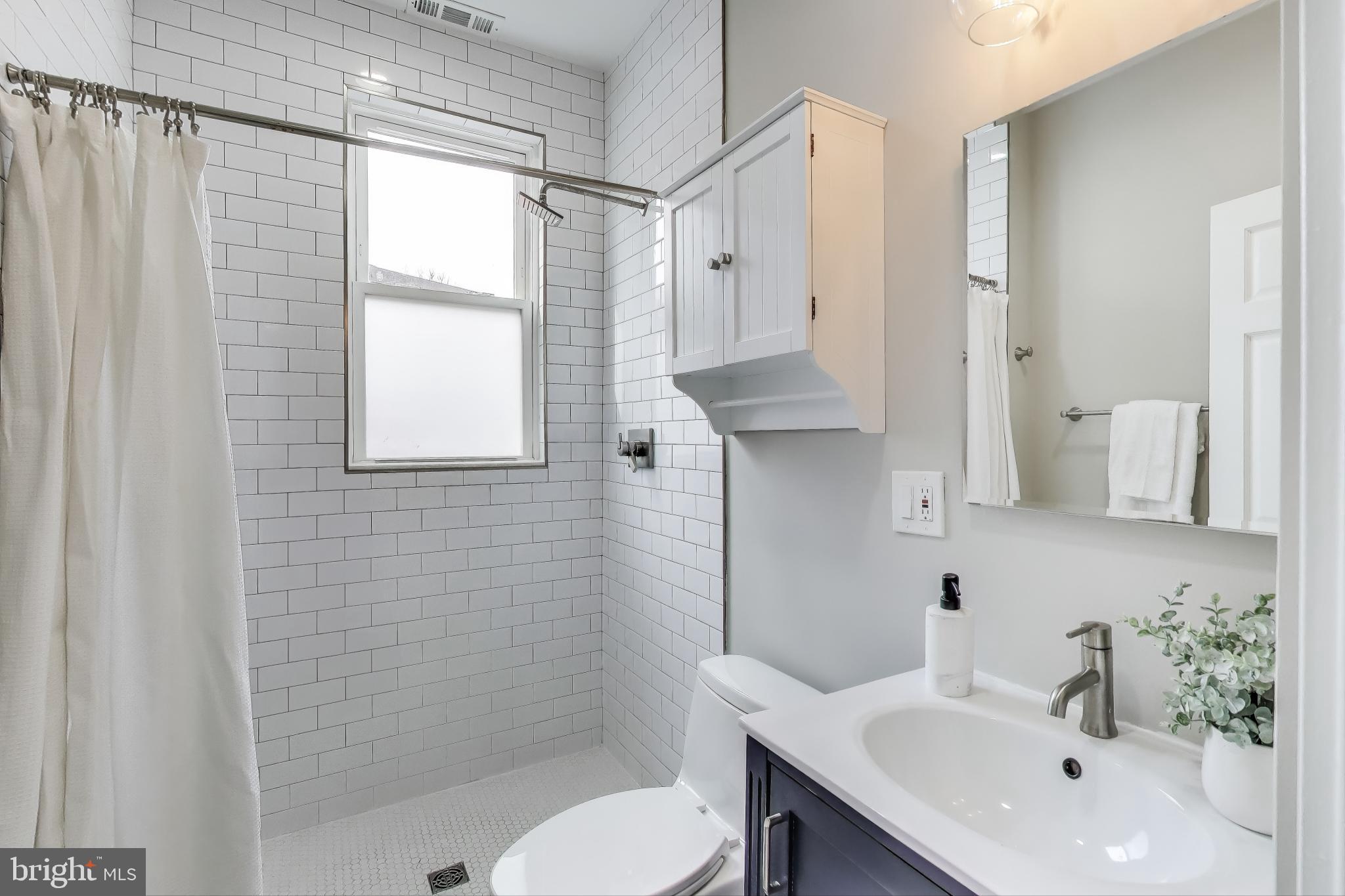 1415 G Street Southeast Washington, DC 20003 - Photo 19 of 42 a bathroom with a sink toilet and shower
