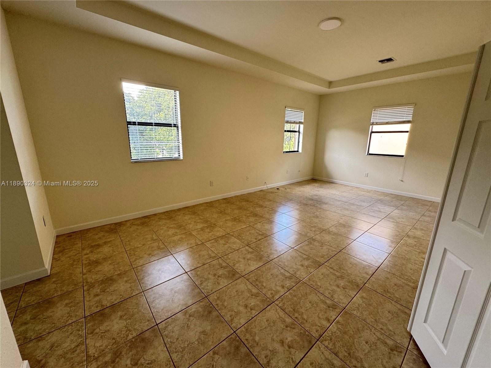 11291 Southwest 240 Lane Homestead, FL 33032 - Photo 11 of 22 a view of an empty room with a window