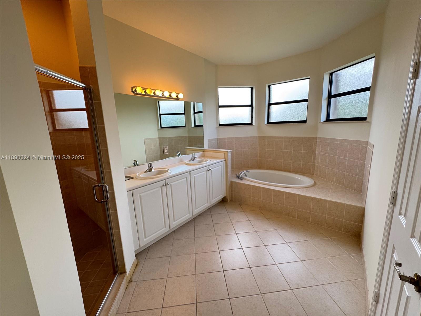 11291 Southwest 240 Lane Homestead, FL 33032 - Photo 13 of 22 a bathroom with a granite countertop sink toilet and mirror