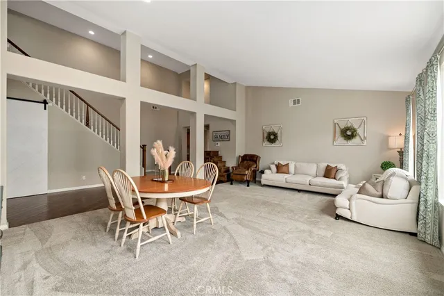a living room with fireplace furniture and a flat screen tv