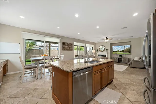 a view of a house with a yard and sitting area