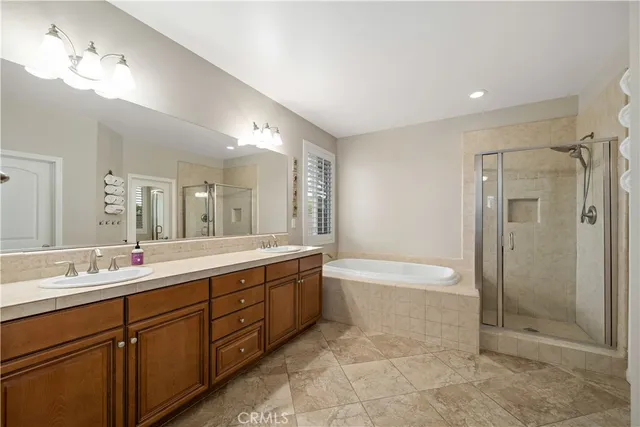 a living room with furniture a ceiling fan and a window