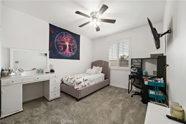 an aerial view of a house with a yard and potted plants