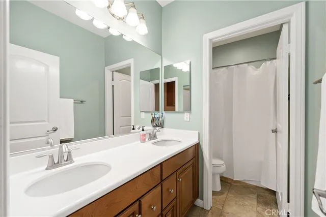 an aerial view of a house with garden space and street view