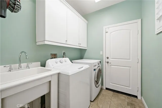an aerial view of residential houses with outdoor space and swimming pool