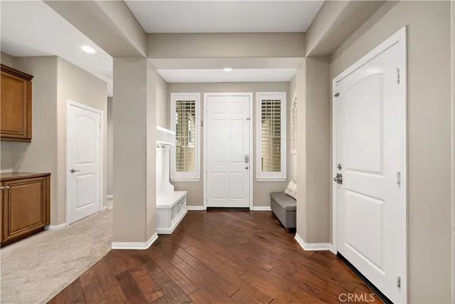 a view of a livingroom with furniture hardwood floor and a living room
