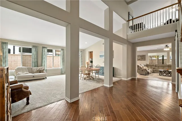 a view of staircase with wooden floor and windows