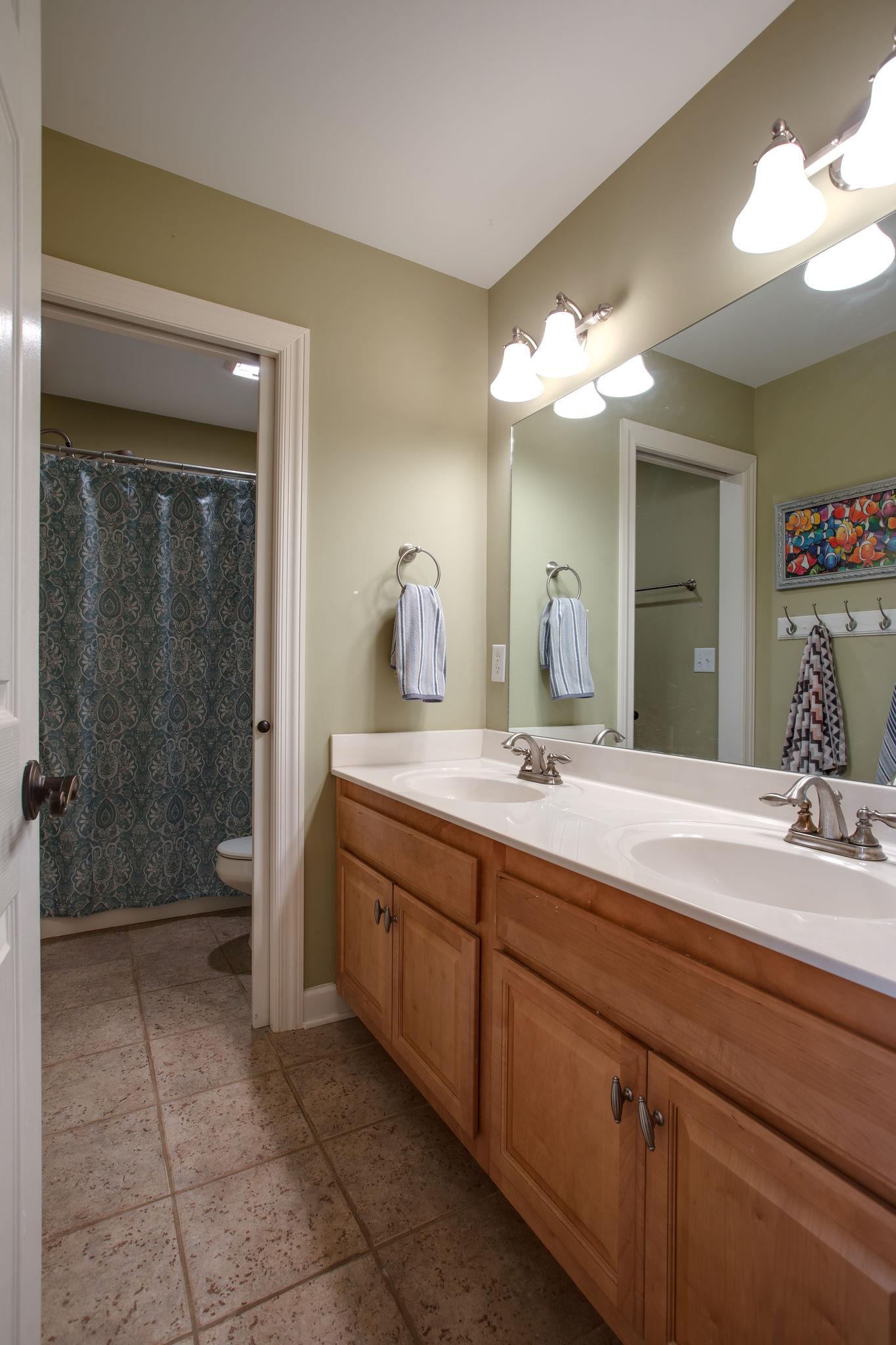 9552 Mullins Road Arrington, TN 37014 - Photo 22 of 30 Bathroom 2. The separation of the tub and sinks makes sharing this bathroom SO much easier.