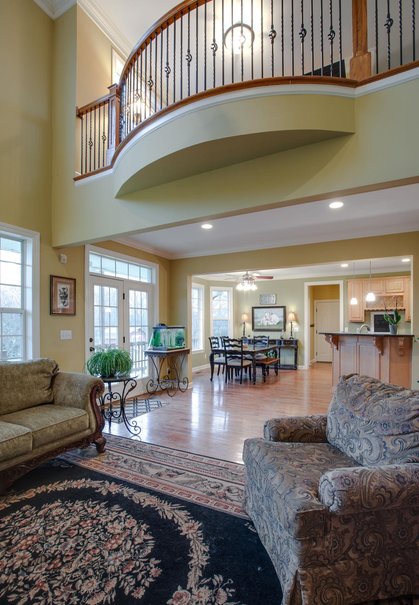 9552 Mullins Road Arrington, TN 37014 - Photo 9 of 30 The living room has vaulted ceilings and a Juliet balcony.