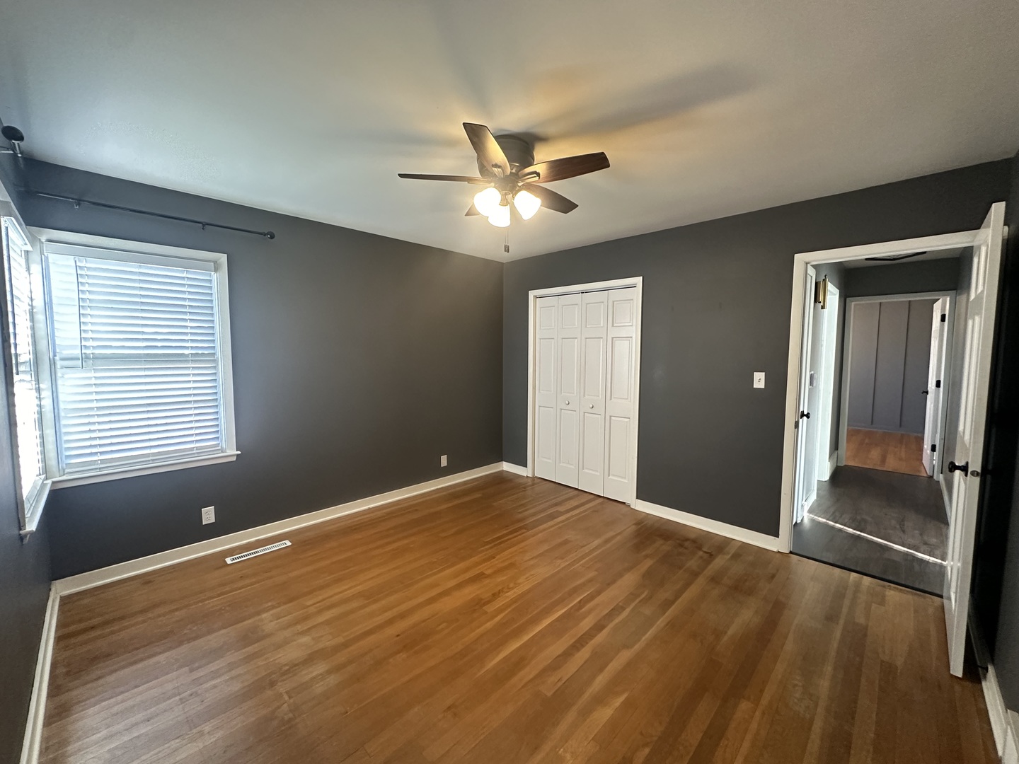 412 East Main Street Morrison, IL 61270 - Photo 14 of 23 a view of a livingroom with a ceiling fan and window