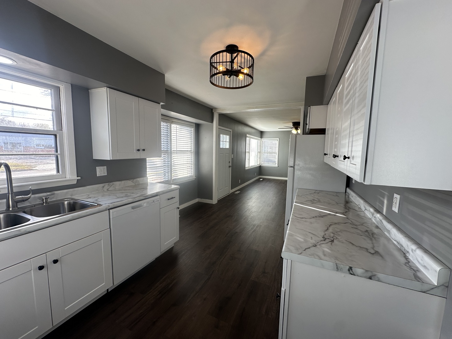 412 East Main Street Morrison, IL 61270 - Photo 6 of 23 a bathroom with a sink and a large mirror