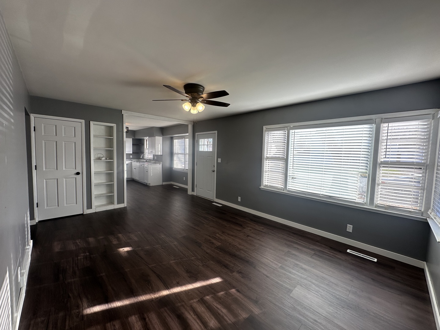 412 East Main Street Morrison, IL 61270 - Photo 8 of 23 a view of an empty room with a window and wooden floor