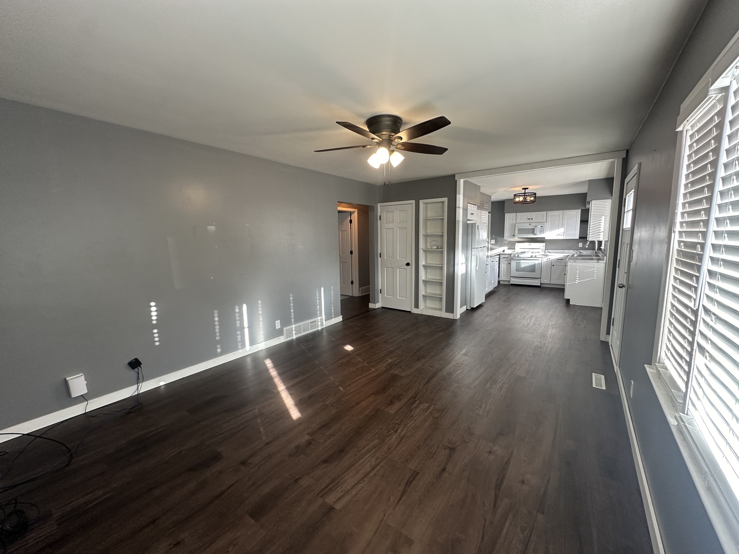412 East Main Street Morrison, IL 61270 - Photo 10 of 23 wooden floor in an empty room with a window