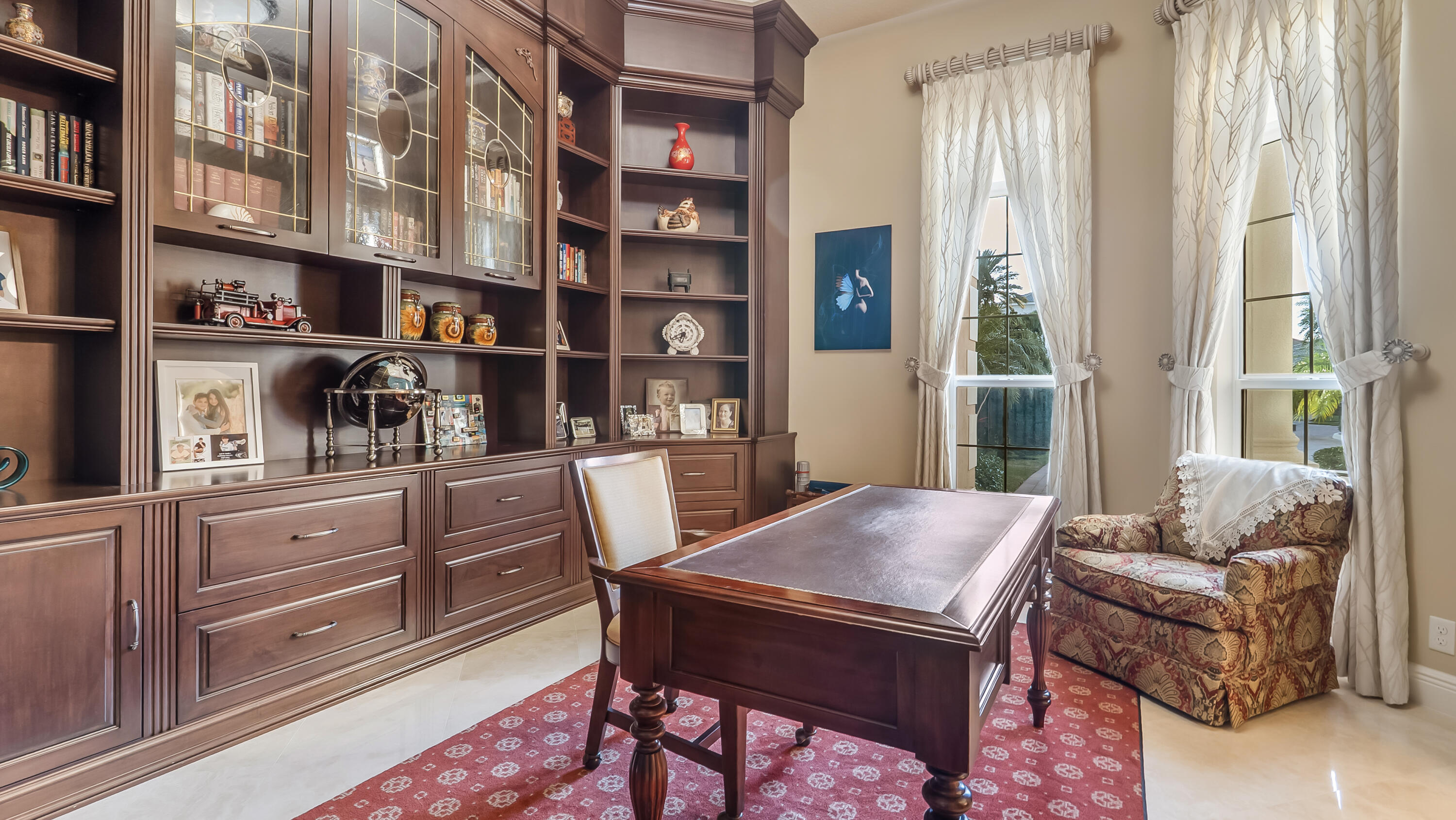 17384 Vistancia Circle Boca Raton, FL 33496 - Photo 15 of 52 a view of a workspace with furniture and a book shelf