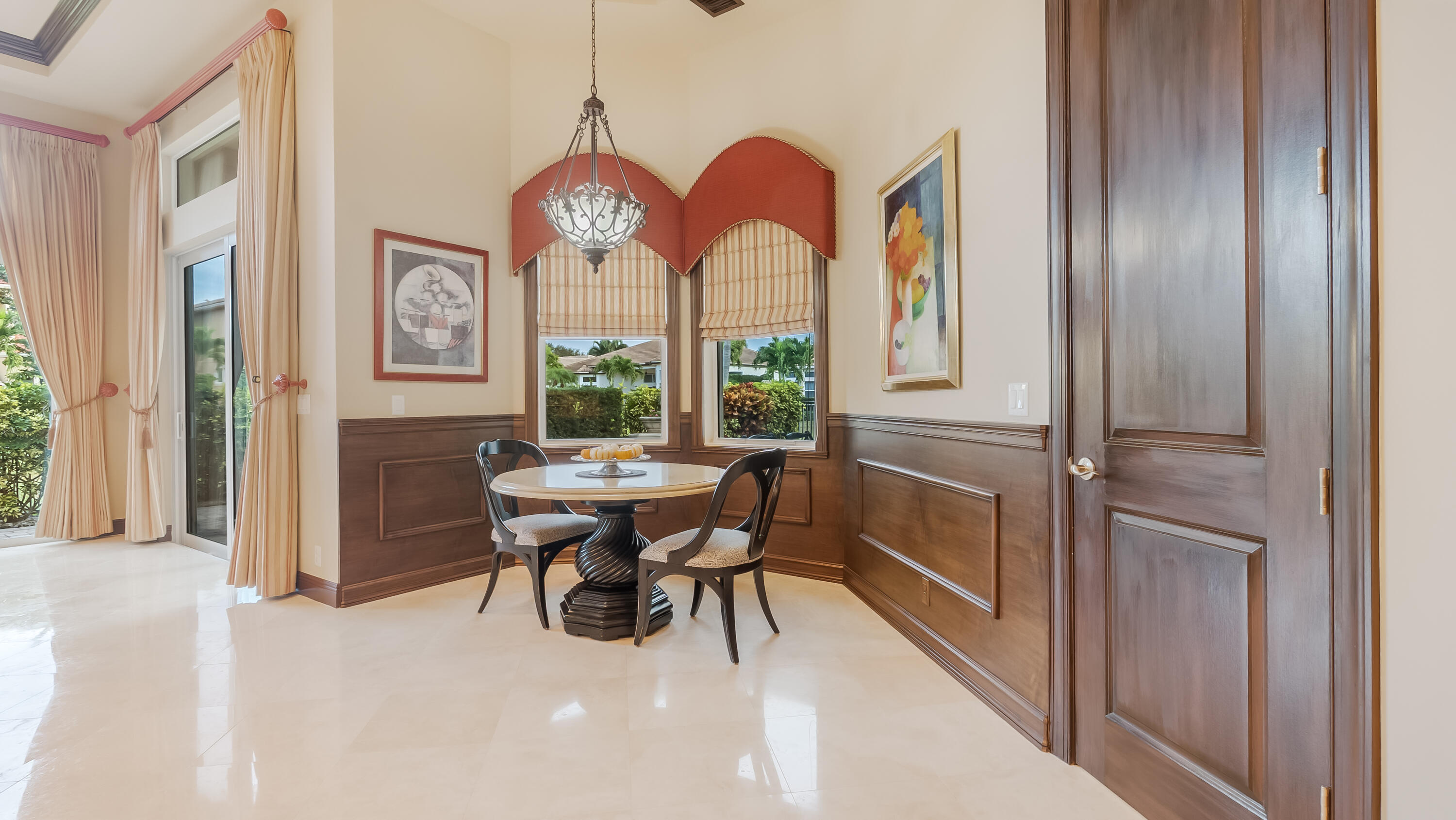 17384 Vistancia Circle Boca Raton, FL 33496 - Photo 32 of 52 a view of a dining room with furniture window and wooden floor