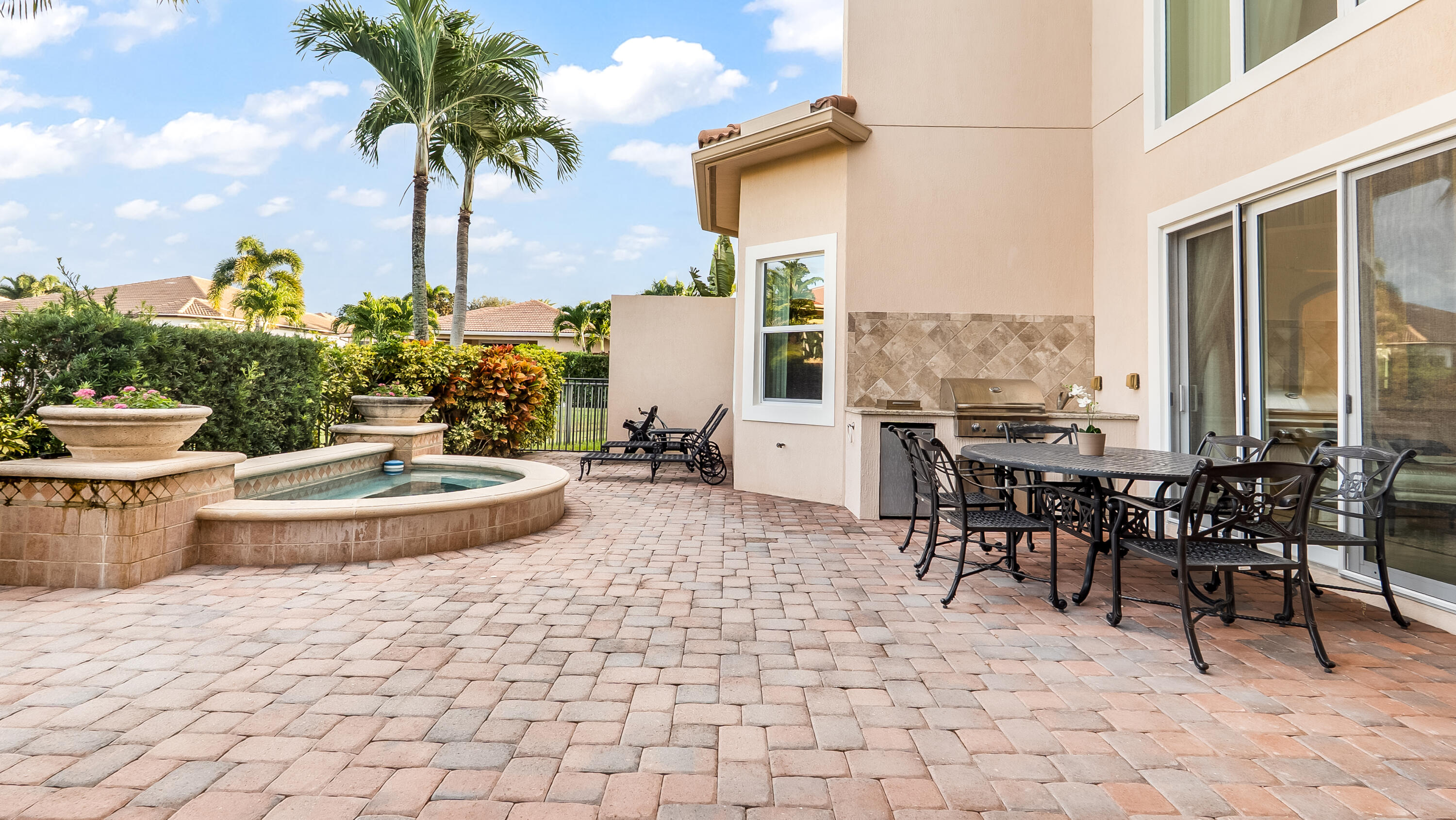 17384 Vistancia Circle Boca Raton, FL 33496 - Photo 44 of 52 a view of a patio with a table and chairs