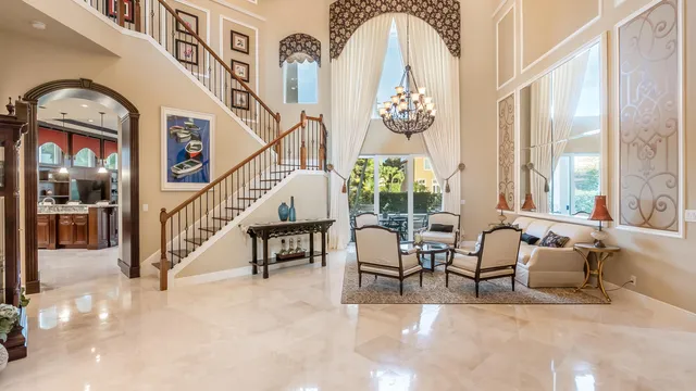 a view of hall way with furniture and staircase