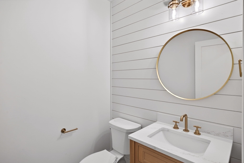 132 Great Western Road Harwich, MA 02645 - Photo 36 of 42 a bathroom with a sink a toilet and a mirror