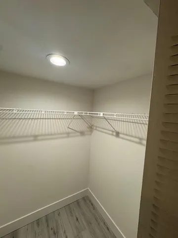 a view of a room with racks on the wall