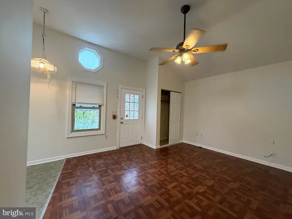 a view of a kitchen with a sink and a window