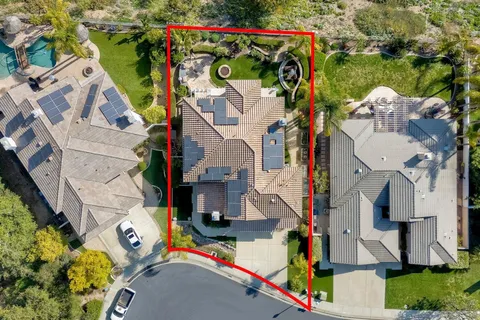 an aerial view of houses with outdoor space