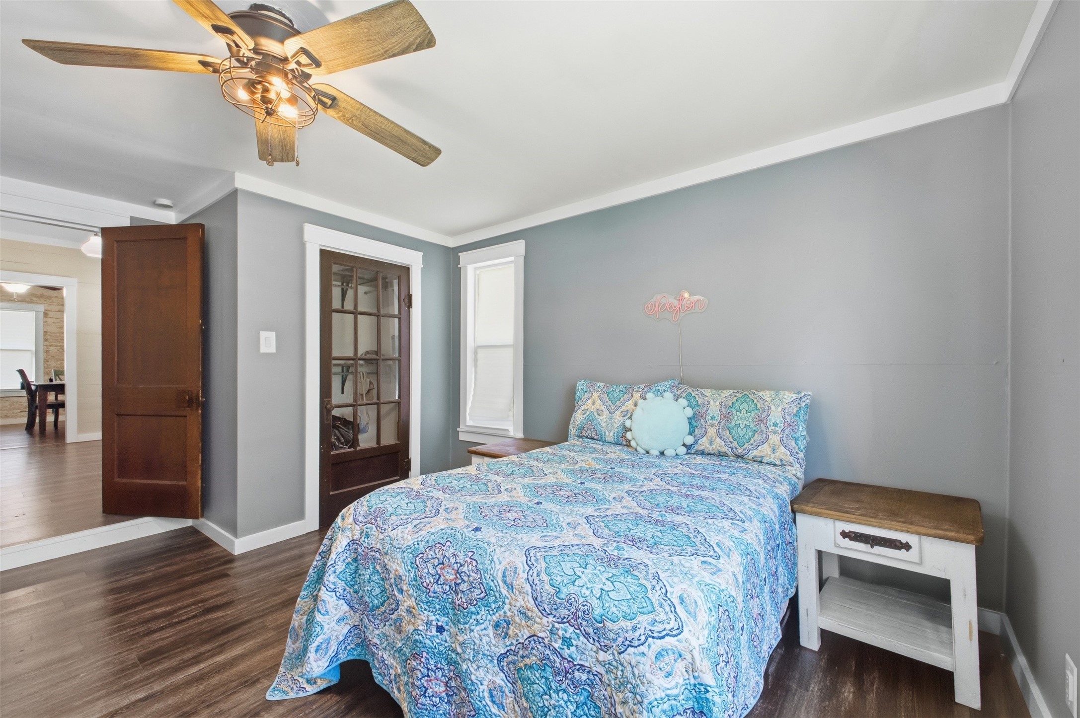 1903 Tigerpoint Road Brenham, TX 77833 - Photo 13 of 27 a bedroom with a bed and a chandelier