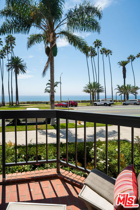 1033 Ocean Avenue, Unit 104 Santa Monica, CA 90403 - Photo 22 of 26 a view of a swimming pool with a table and chairs