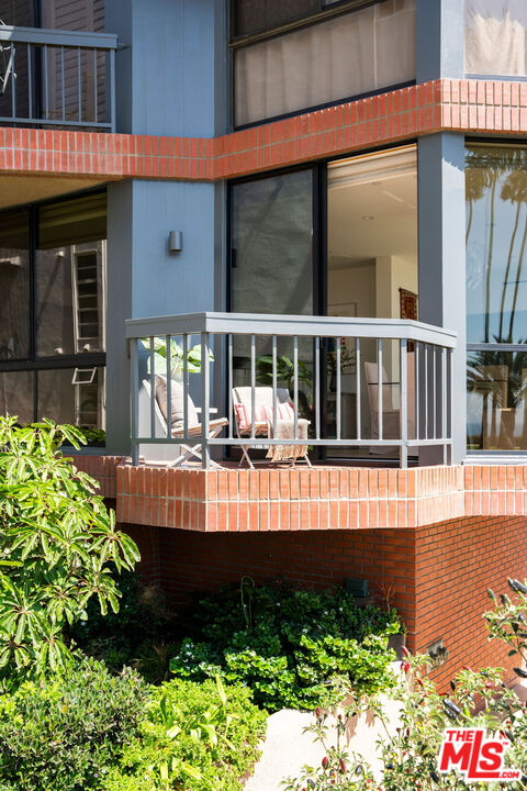 1033 Ocean Avenue, Unit 104 Santa Monica, CA 90403 - Photo 23 of 26 a front view of a house with a yard swimming pool and outdoor seating