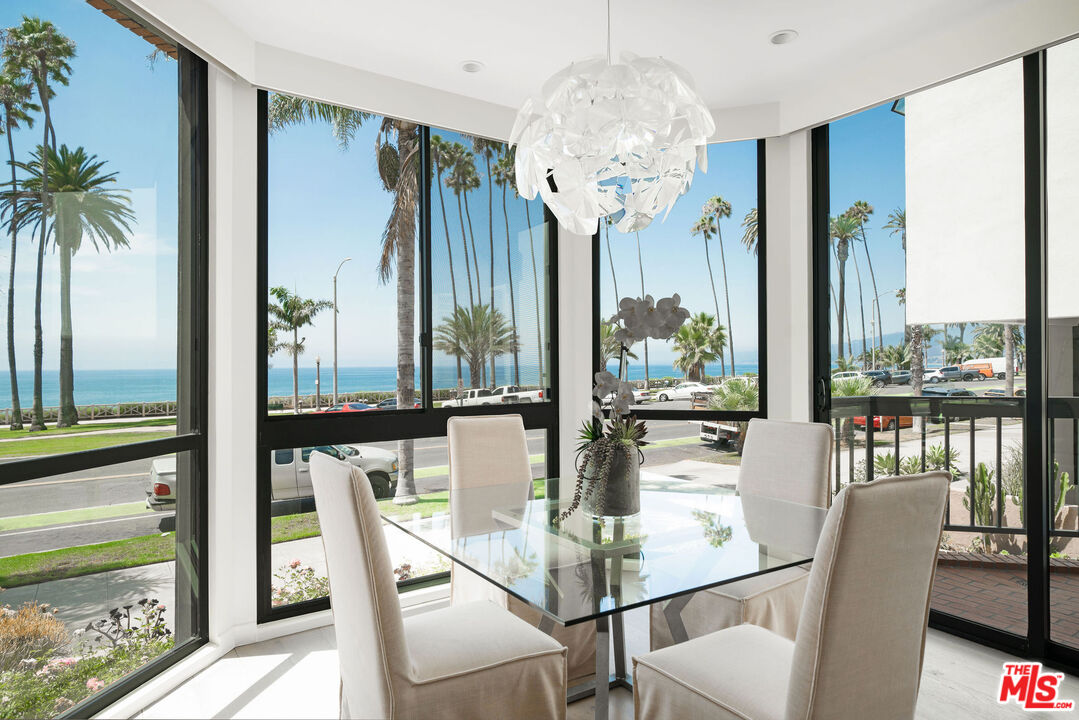 1033 Ocean Avenue, Unit 104 Santa Monica, CA 90403 - Photo 4 of 26 a view of a dining room with furniture window and outside view