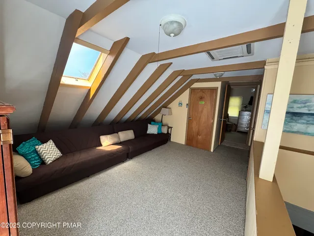 a view of livingroom with furniture and stairs